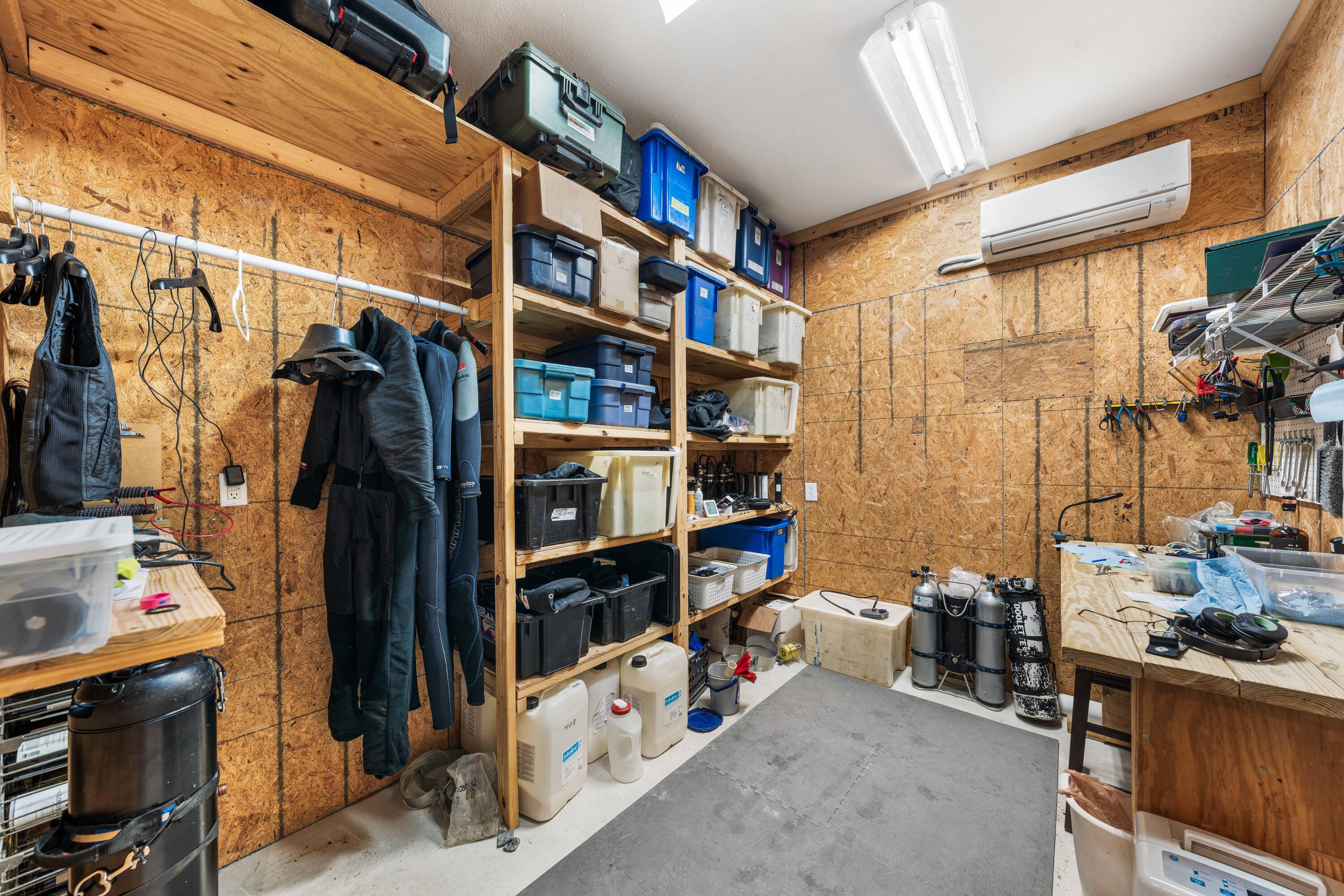 556 Little Canal Drive Santa Rosa Beach, FL 32459 - Photo 10 of 60 a view of walk in closet with clothes and shoes