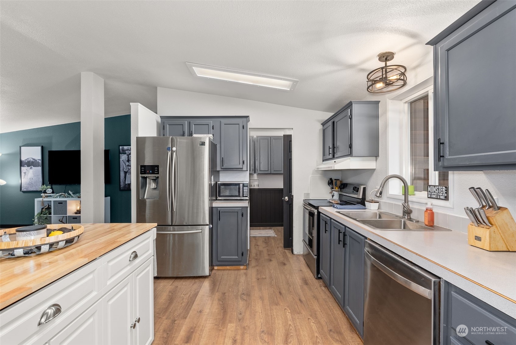 888 Logan Hill Road Chehalis, WA 98532 - Photo 10 of 35 a kitchen with a sink stove and refrigerator