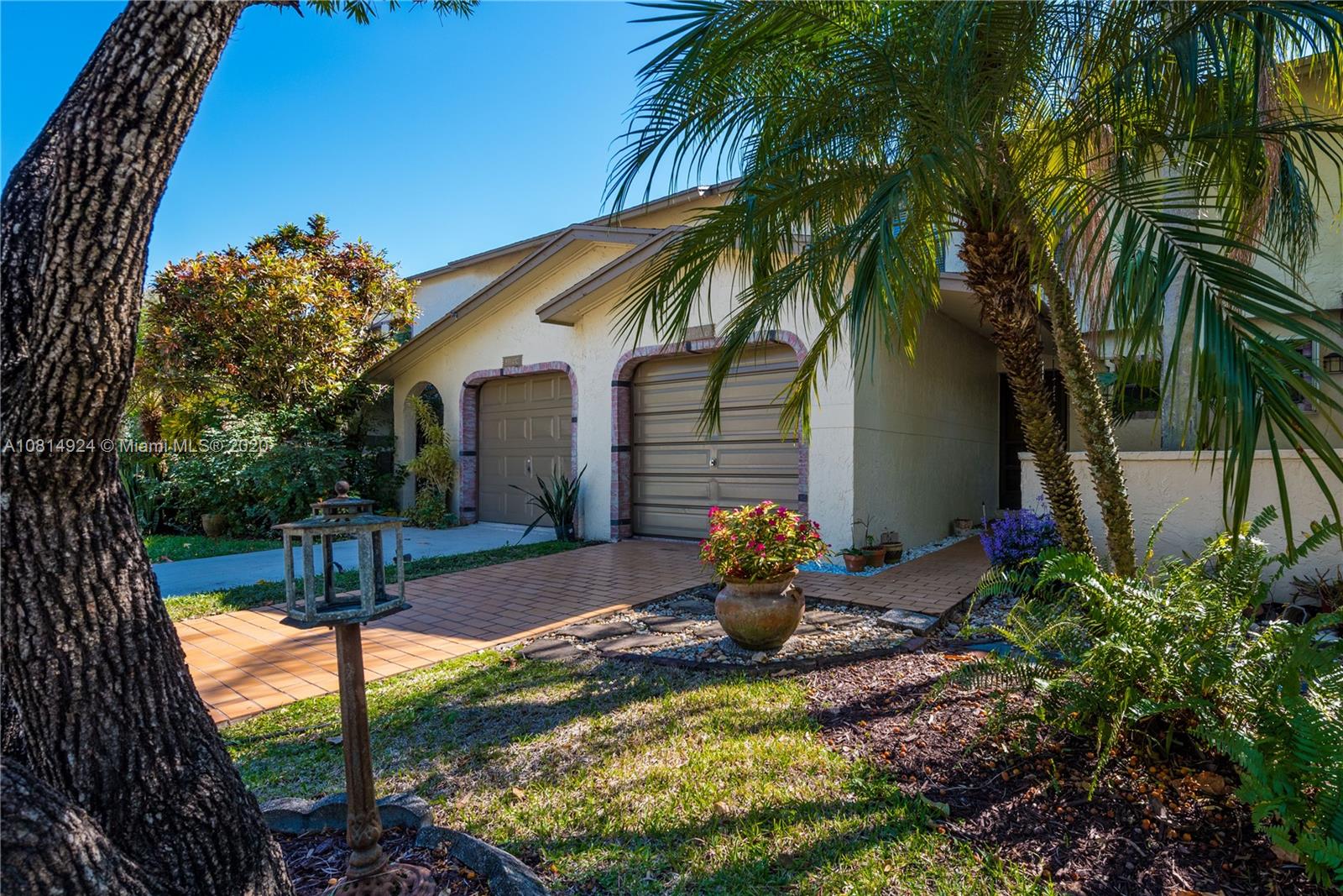 8814 Southwest 22nd Street, Unit B Boca Raton, FL 33433 - Photo 1 of 38 a view of a house with backyard and sitting area