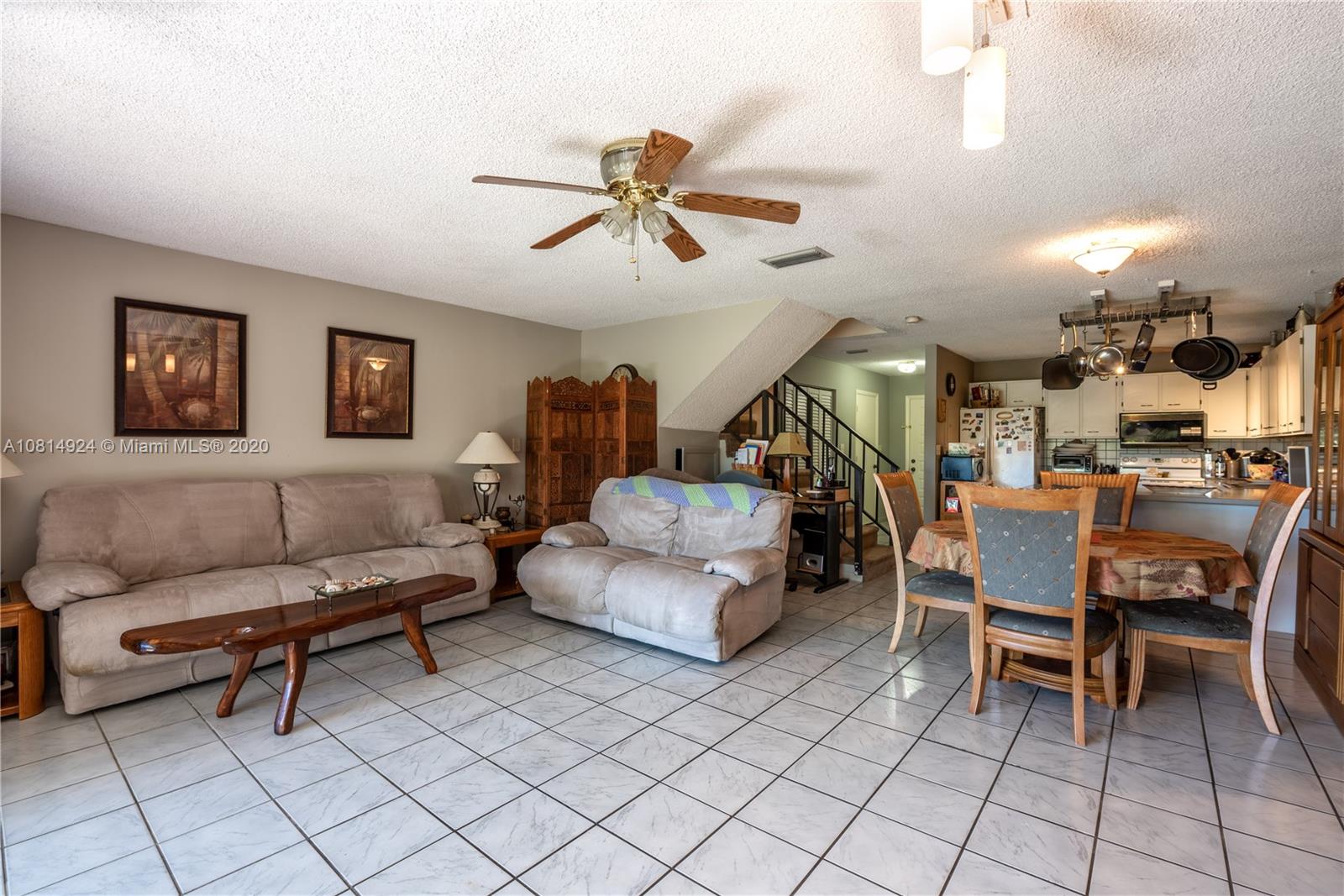 8814 Southwest 22nd Street, Unit B Boca Raton, FL 33433 - Photo 12 of 38 a living room with furniture and a ceiling fan