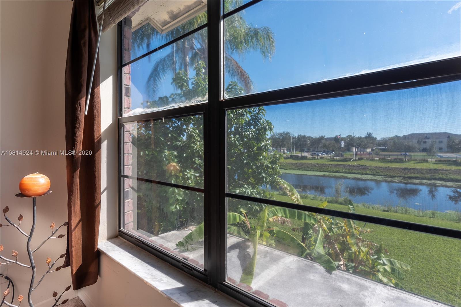 8814 Southwest 22nd Street, Unit B Boca Raton, FL 33433 - Photo 16 of 38 a view of lake from window