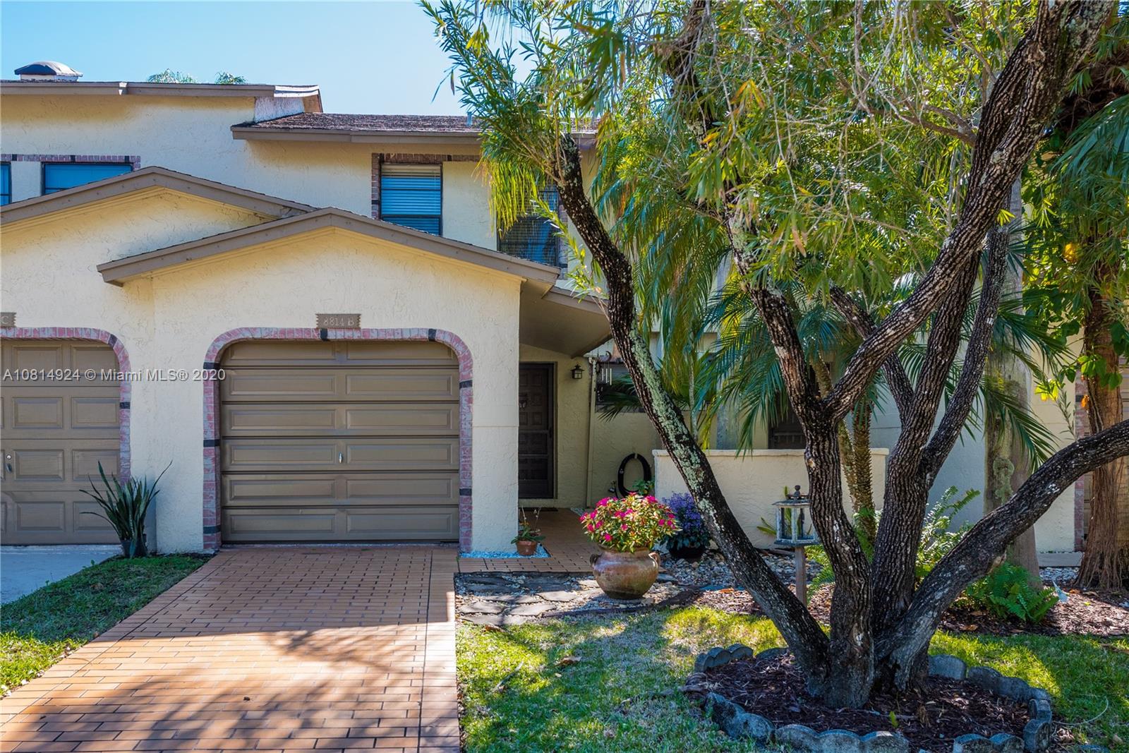 8814 Southwest 22nd Street, Unit B Boca Raton, FL 33433 - Photo 2 of 38 a view of a house with a backyard