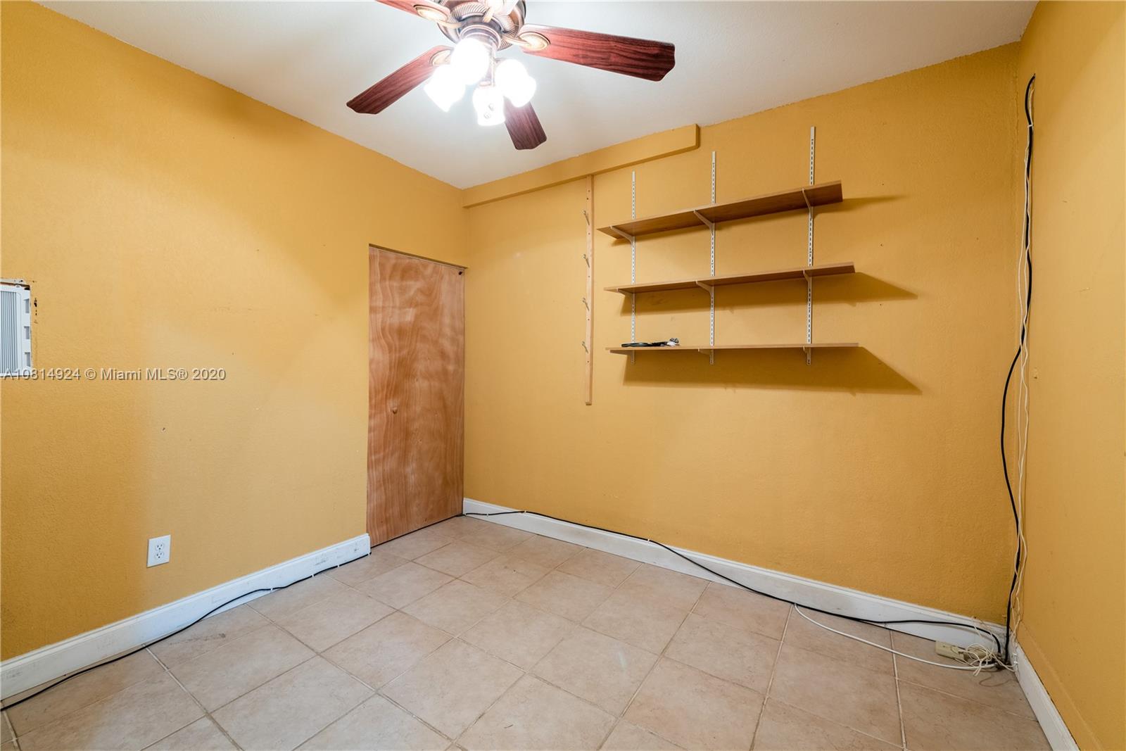 8814 Southwest 22nd Street, Unit B Boca Raton, FL 33433 - Photo 27 of 38 an empty room with a empty space and a ceiling fan
