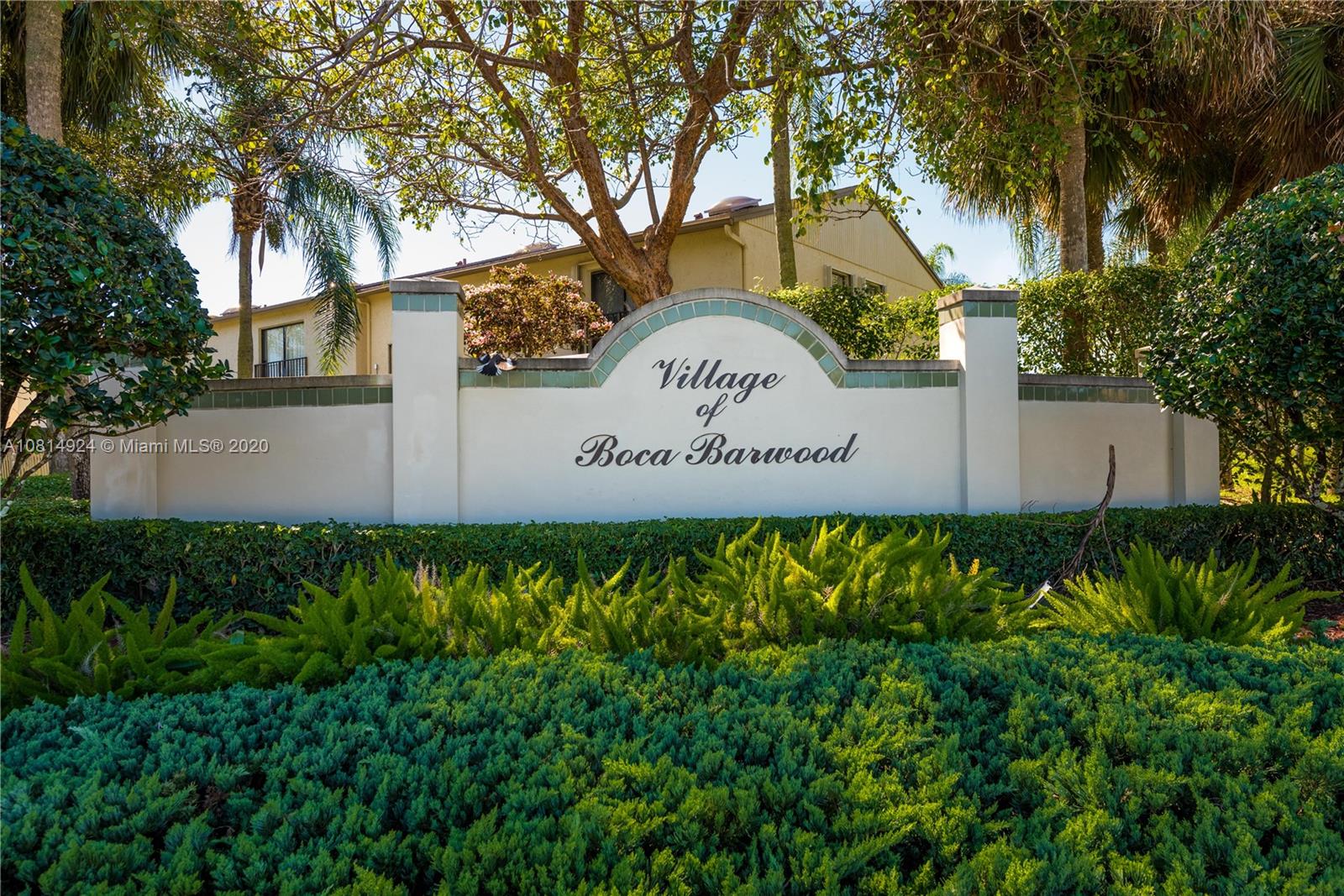 8814 Southwest 22nd Street, Unit B Boca Raton, FL 33433 - Photo 28 of 38 a sign on the side of a building