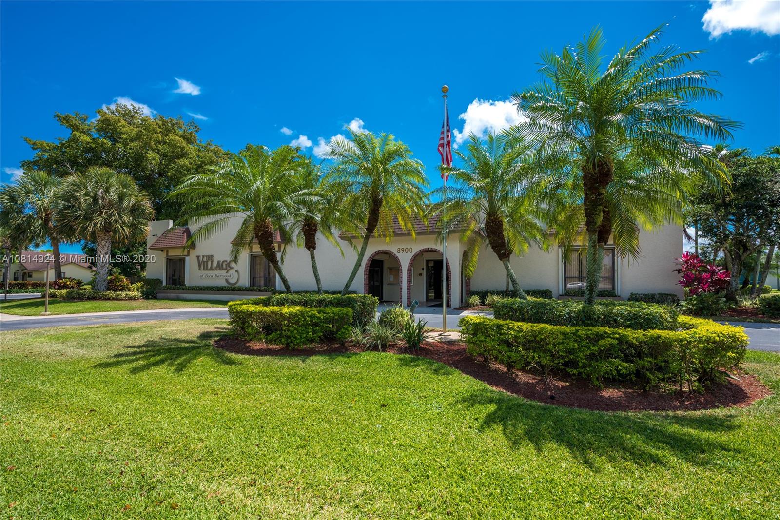8814 Southwest 22nd Street, Unit B Boca Raton, FL 33433 - Photo 29 of 38 a front view of a house with garden