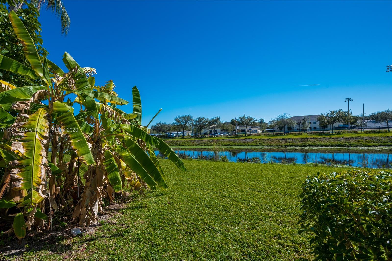8814 Southwest 22nd Street, Unit B Boca Raton, FL 33433 - Photo 10 of 38 a view of a lake with houses in the background