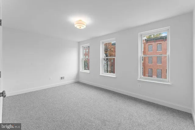 an empty room with windows