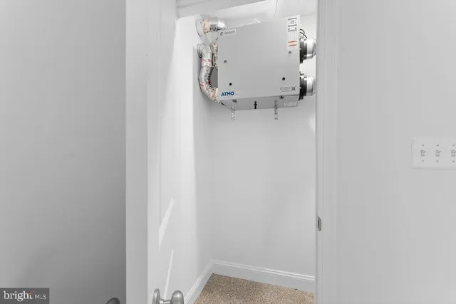 a bed room with a bed and a chair