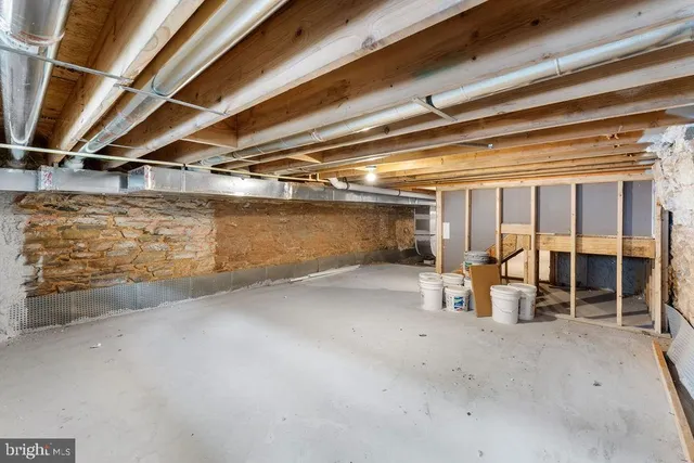 a view of empty room with wooden ceiling