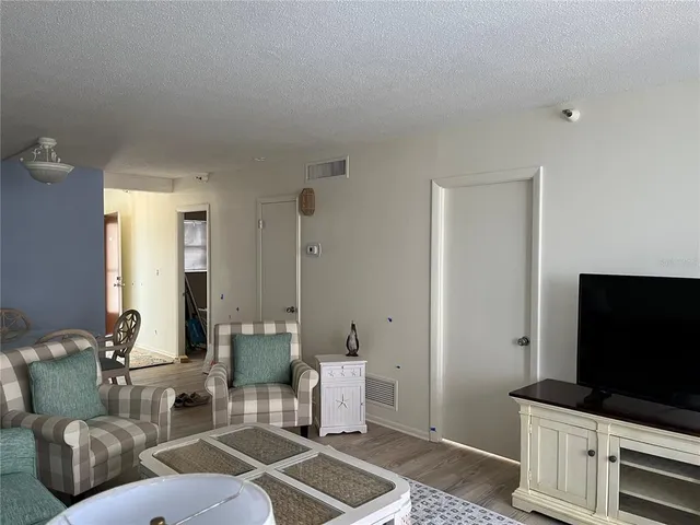 a bedroom with bed and dresser