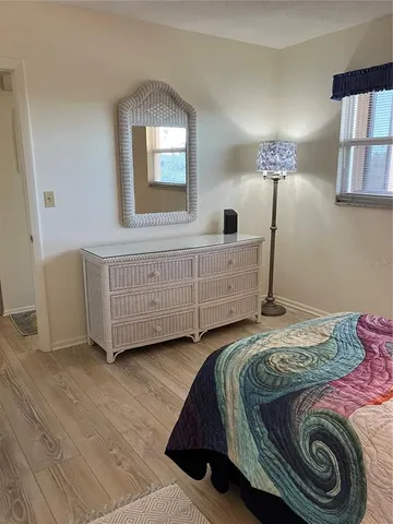 a bathroom with a granite countertop sink a large mirror and a shower