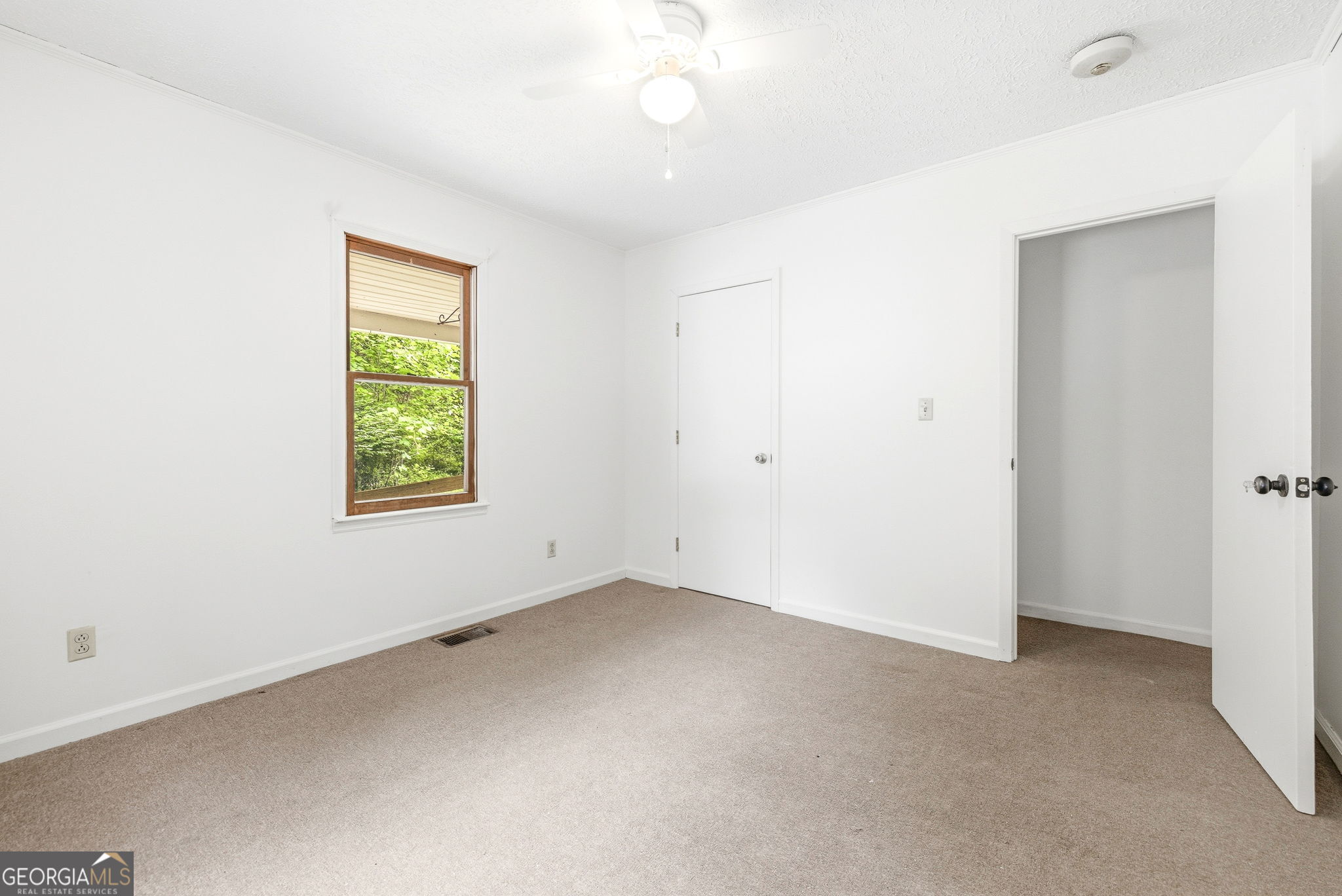 210 Kentucky Street Demorest, GA 30535 - Photo 25 of 30 an empty room with a window
