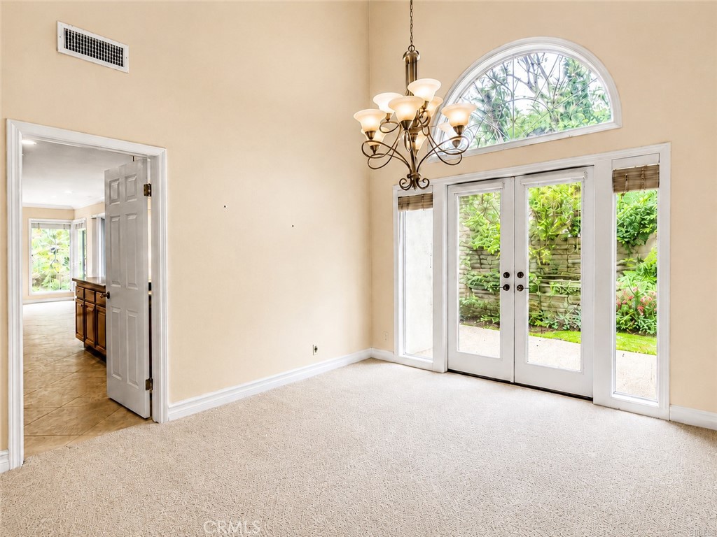 2811 North Roxbury Street Orange, CA 92867 - Photo 6 of 22 a view of a big room with windows and chandelier