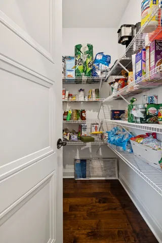 a kitchen with lots of clutter and cabinets