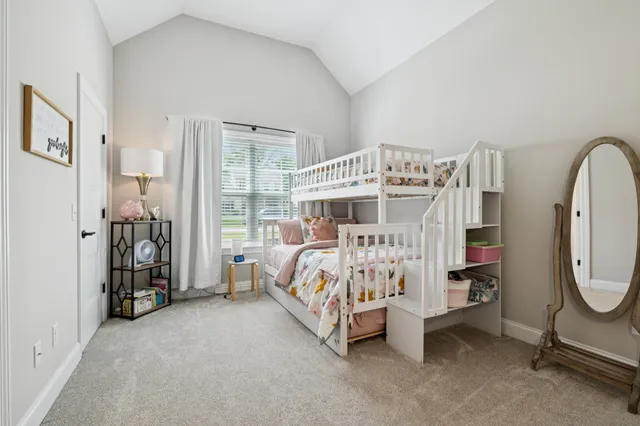 a bed room with a bed and a large window