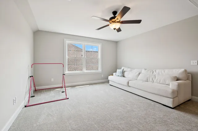 a living room with furniture and windows