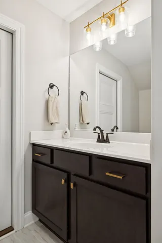 a bathroom with a sink and a mirror