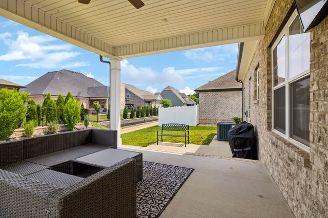 a view of swimming pool with a lounge chairs