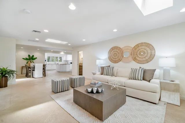 a living room with furniture and a table