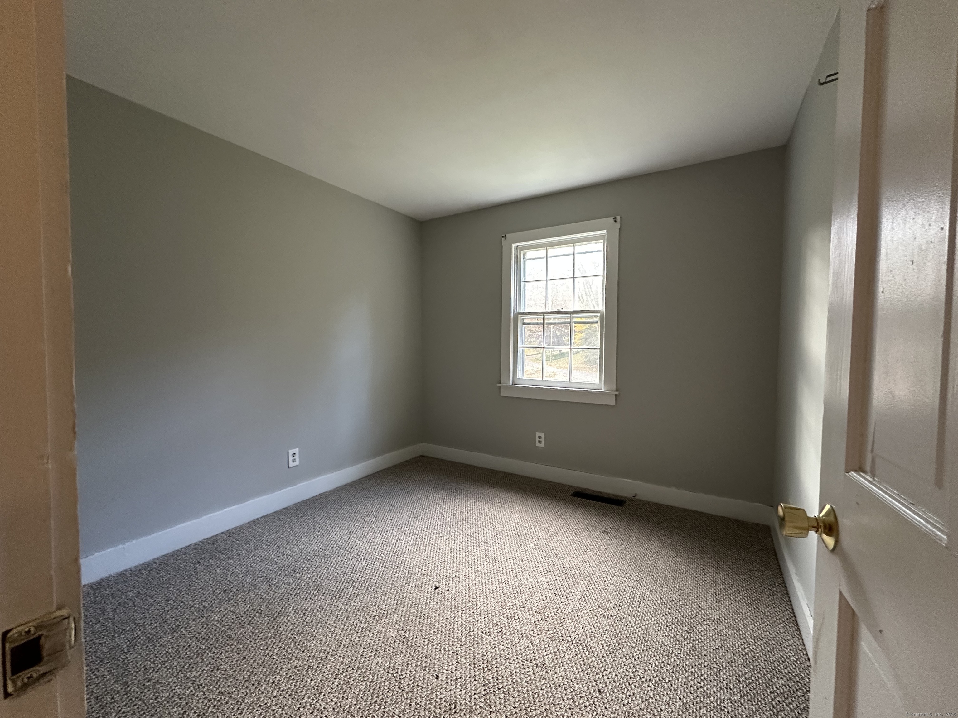 25 Elephant Rock Road, Unit 2 Woodbury, CT 06798 - Photo 13 of 17 an empty room with windows