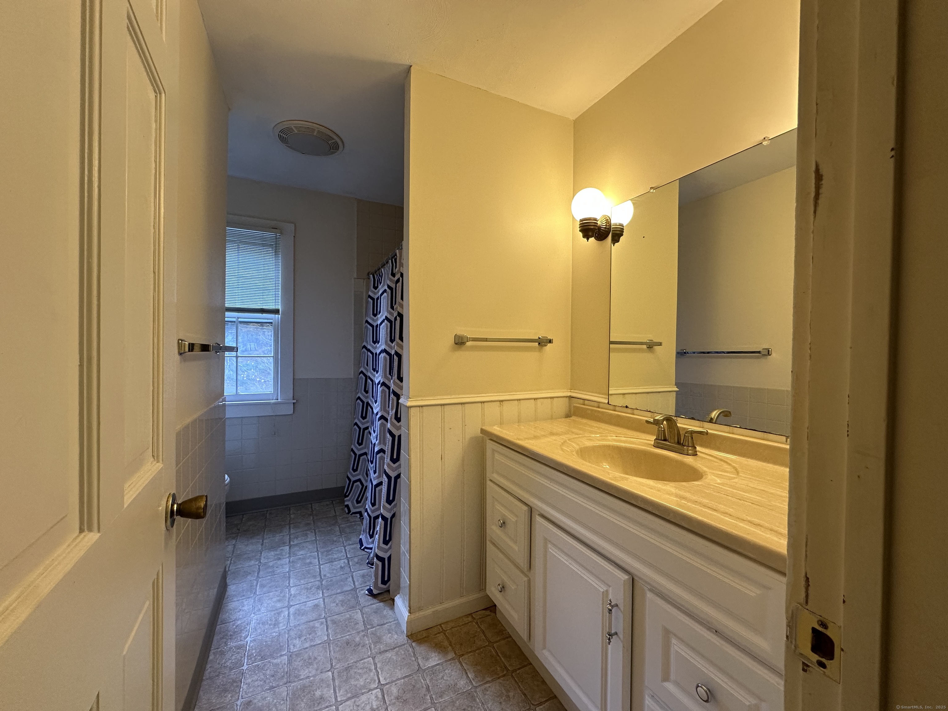 25 Elephant Rock Road, Unit 2 Woodbury, CT 06798 - Photo 14 of 17 a bathroom with a sink and a mirror