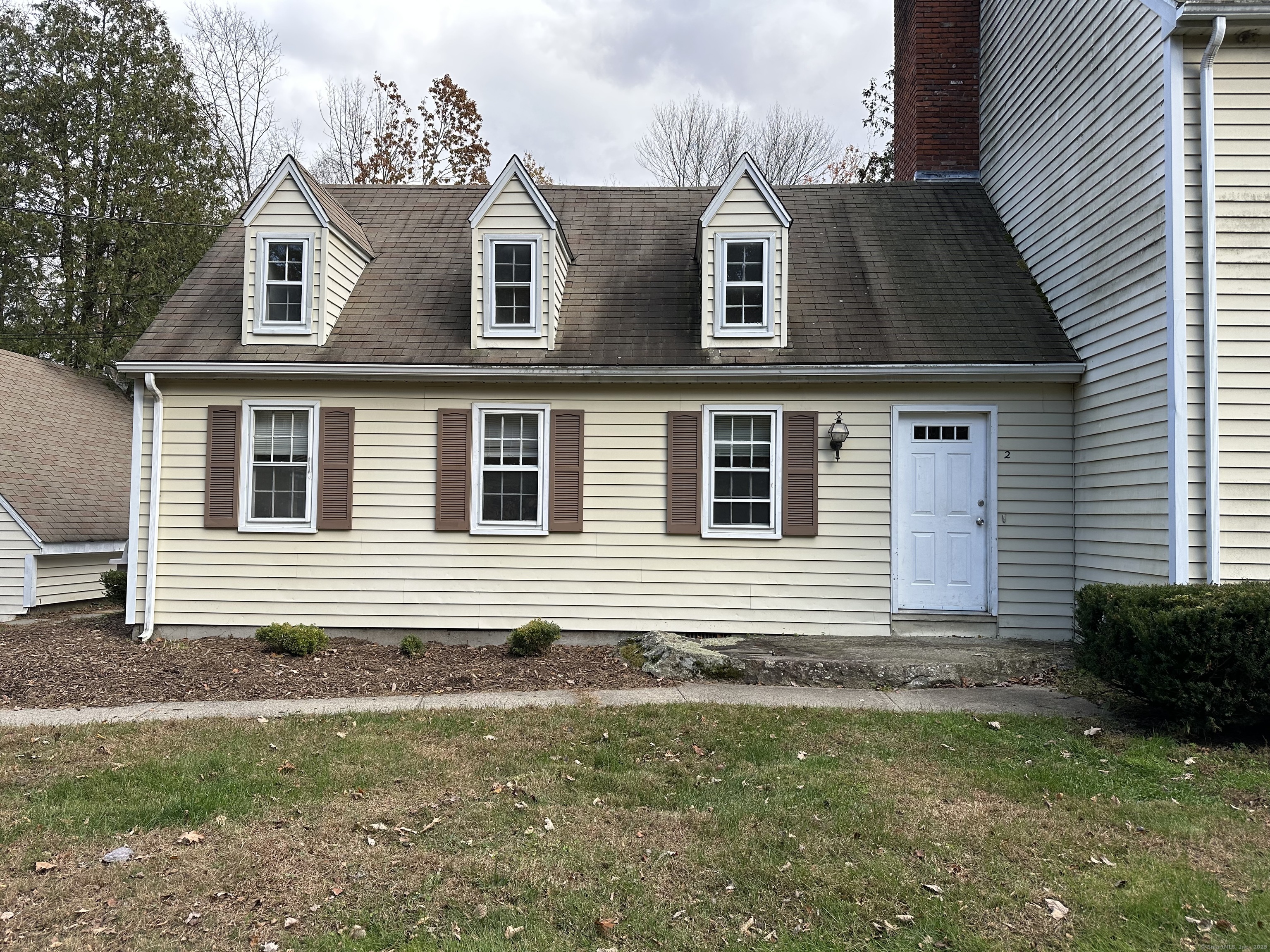 25 Elephant Rock Road, Unit 2 Woodbury, CT 06798 - Photo 2 of 17 a front view of a house