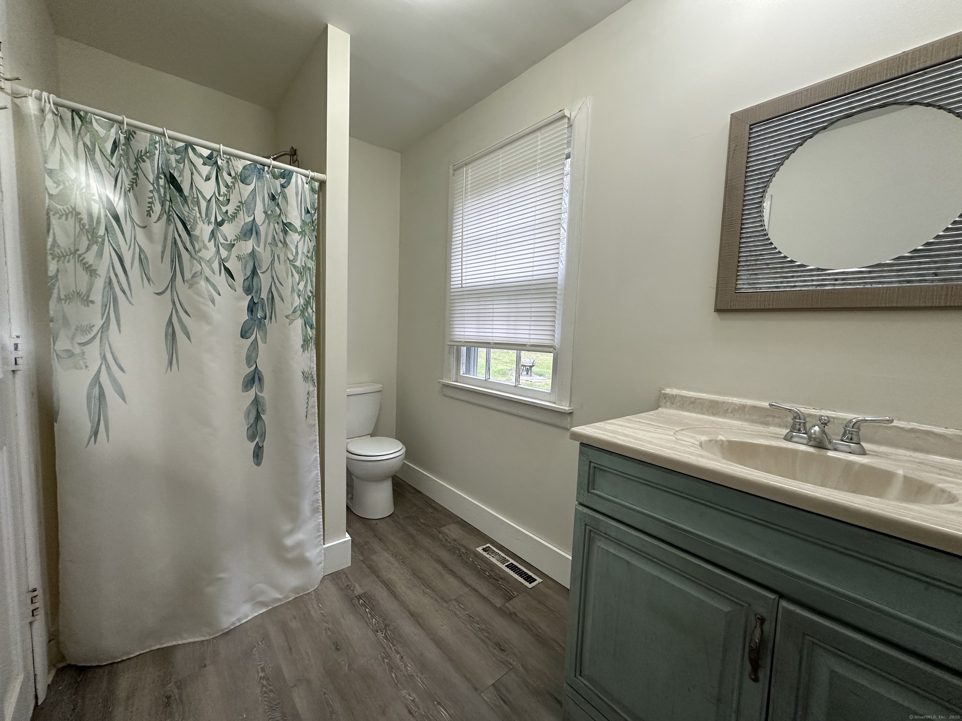 25 Elephant Rock Road, Unit 2 Woodbury, CT 06798 - Photo 10 of 17 a bathroom with a granite countertop sink a toilet and a shower