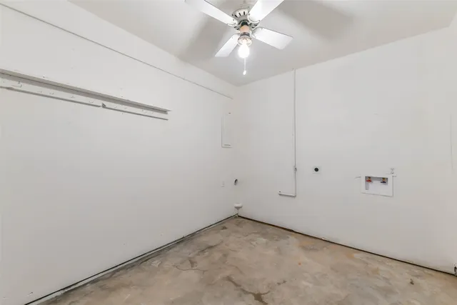 a view of a backyard with wooden fence