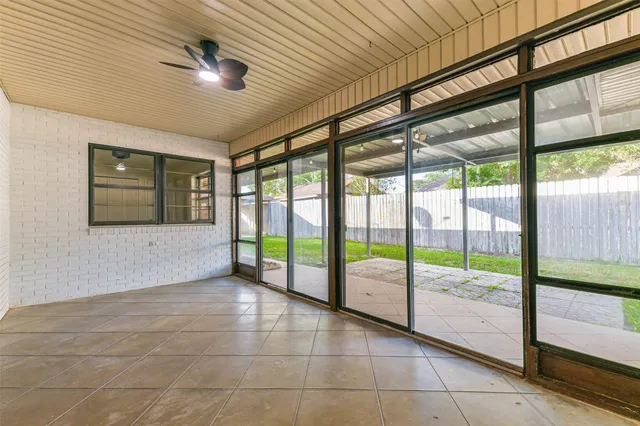 a view of a backyard with seating space