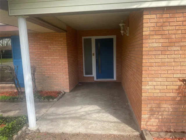 a view of hallway with wooden floor