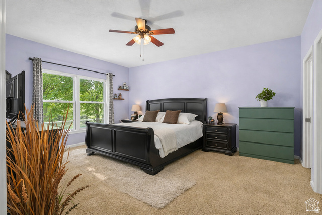 7092 Cherokee Street Eagle Mountain, UT 84005 - Photo 6 of 27 Spacious room featuring multiple windows, a ceiling fan, plush carpet flooring, and a neutral wall color