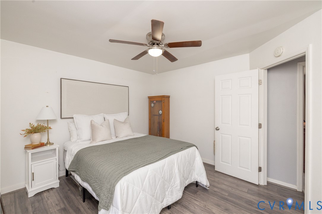 16104 Sandwave Road Chester, VA 23831 - Photo 14 of 24 a bedroom with a bed and wooden floor
