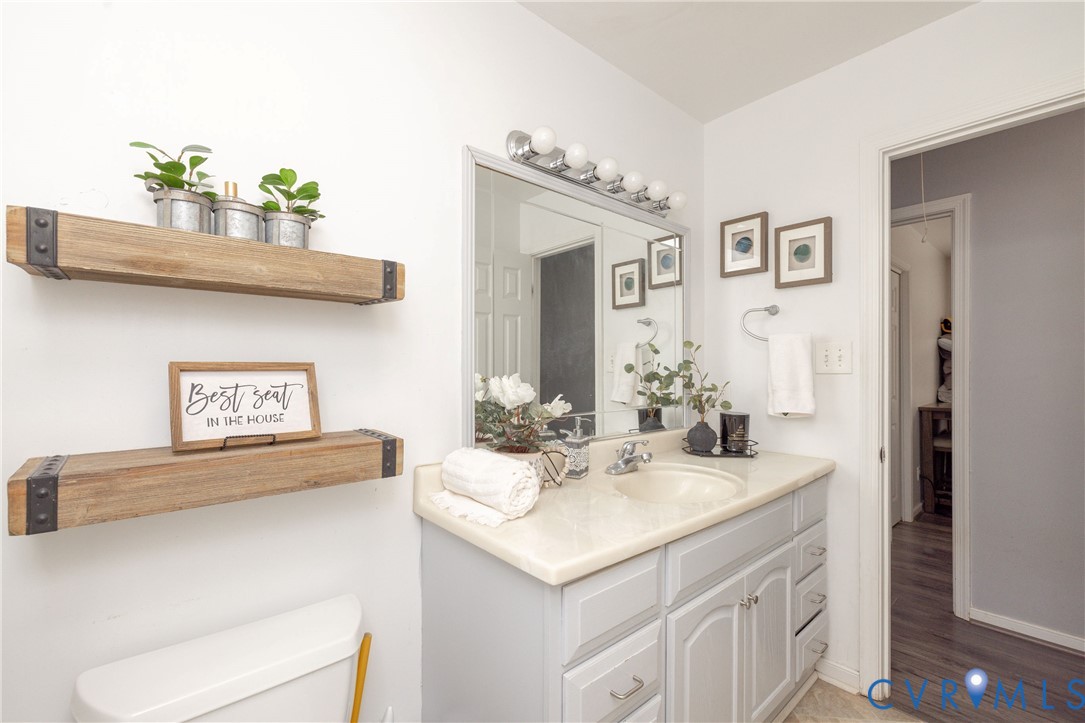 16104 Sandwave Road Chester, VA 23831 - Photo 16 of 24 a bathroom with a sink and a mirror