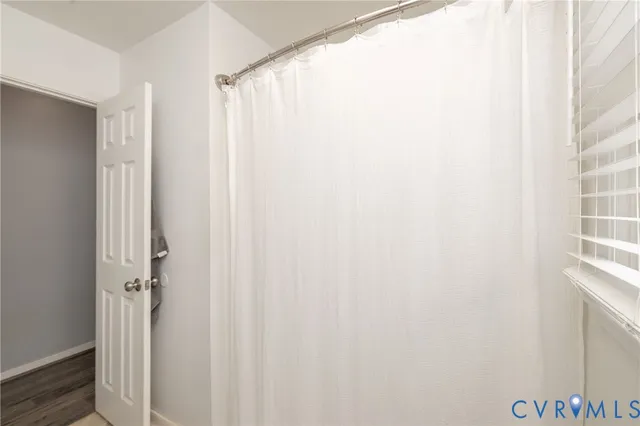 a bathroom with a shower curtain