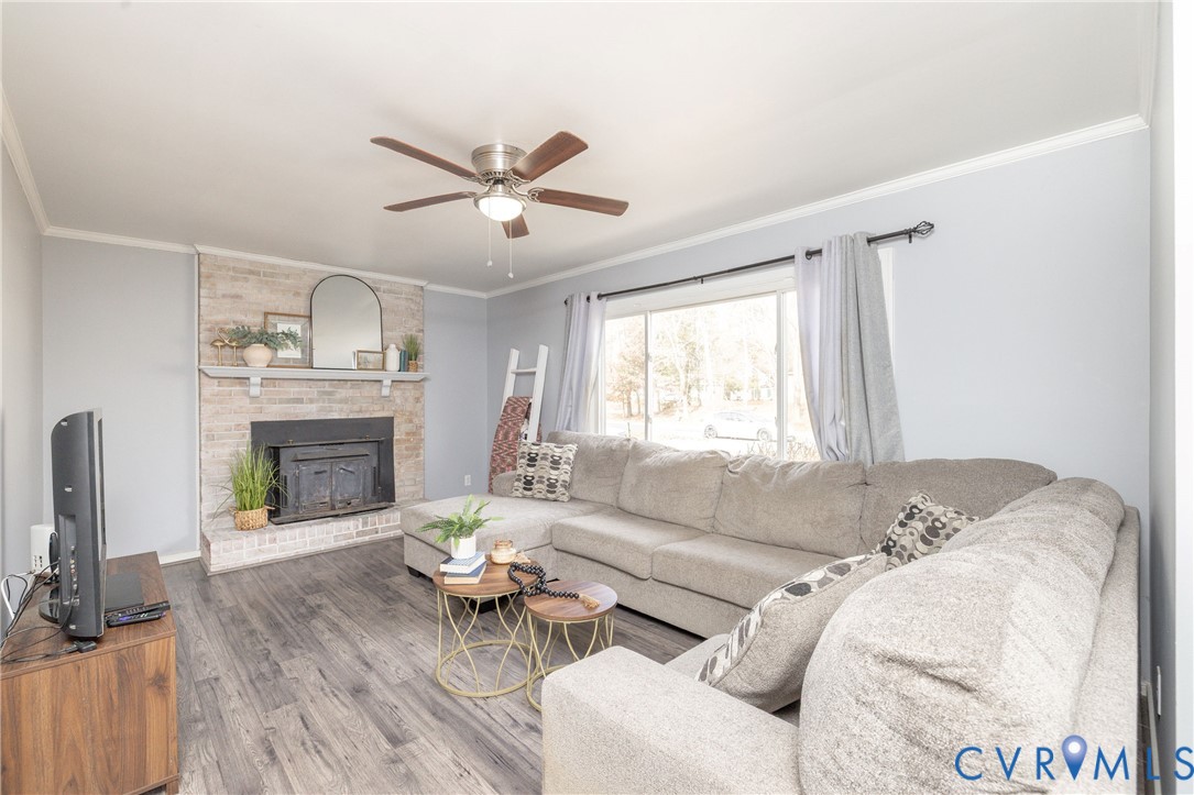 16104 Sandwave Road Chester, VA 23831 - Photo 5 of 24 a living room with furniture and a fireplace