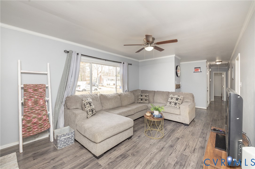 16104 Sandwave Road Chester, VA 23831 - Photo 6 of 24 a living room with furniture and a large window