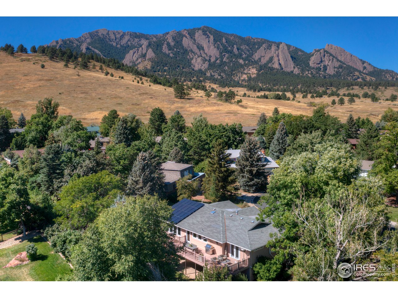 656 Furman Way Boulder, CO 80305 - Photo 2 of 6 a view of a houses with a yard