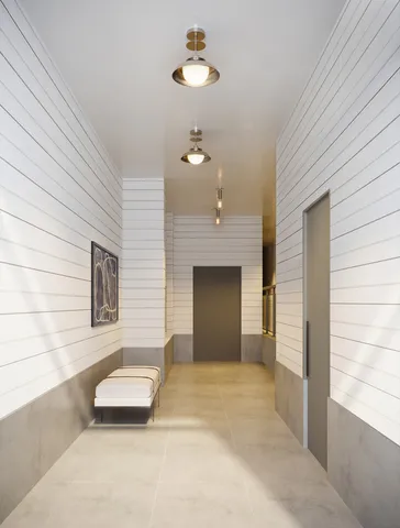 a bathroom with a sink a light fixture and a window