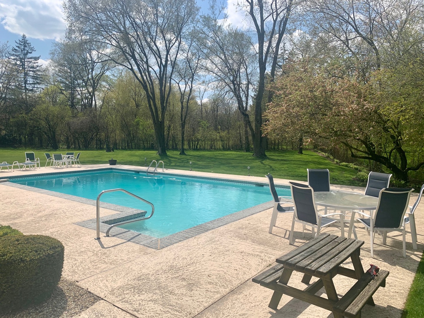 1780 Sunset Ridge Road Northbrook, IL 60062 - Photo 5 of 11 a view of a swimming pool with lawn chairs and plants