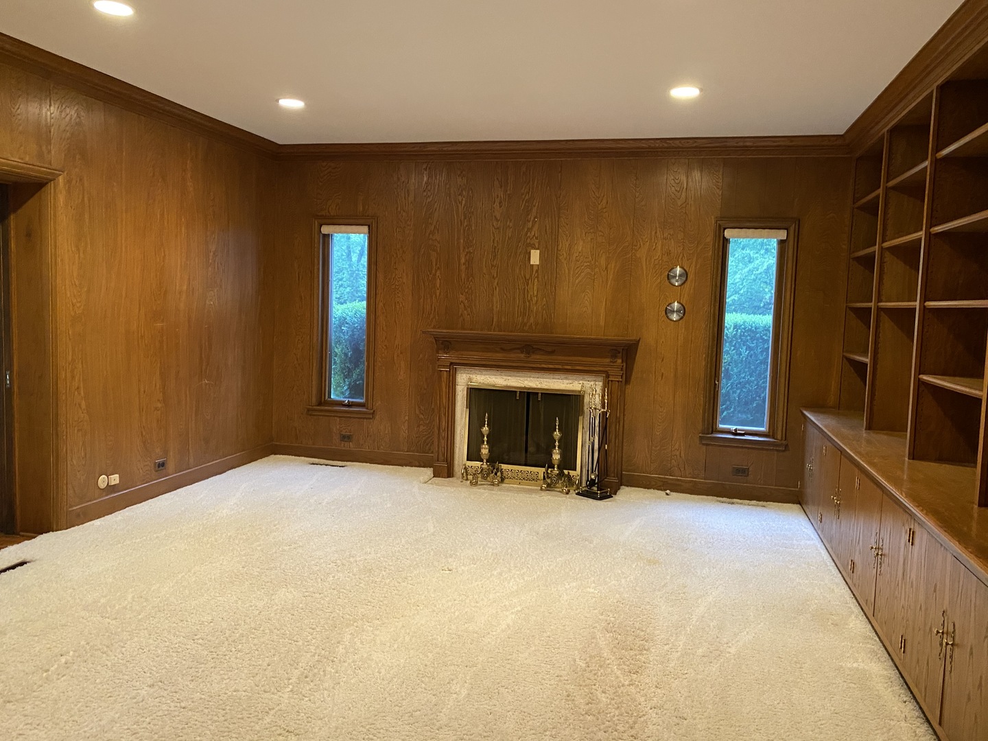 1780 Sunset Ridge Road Northbrook, IL 60062 - Photo 7 of 11 an empty room with fireplace and windows