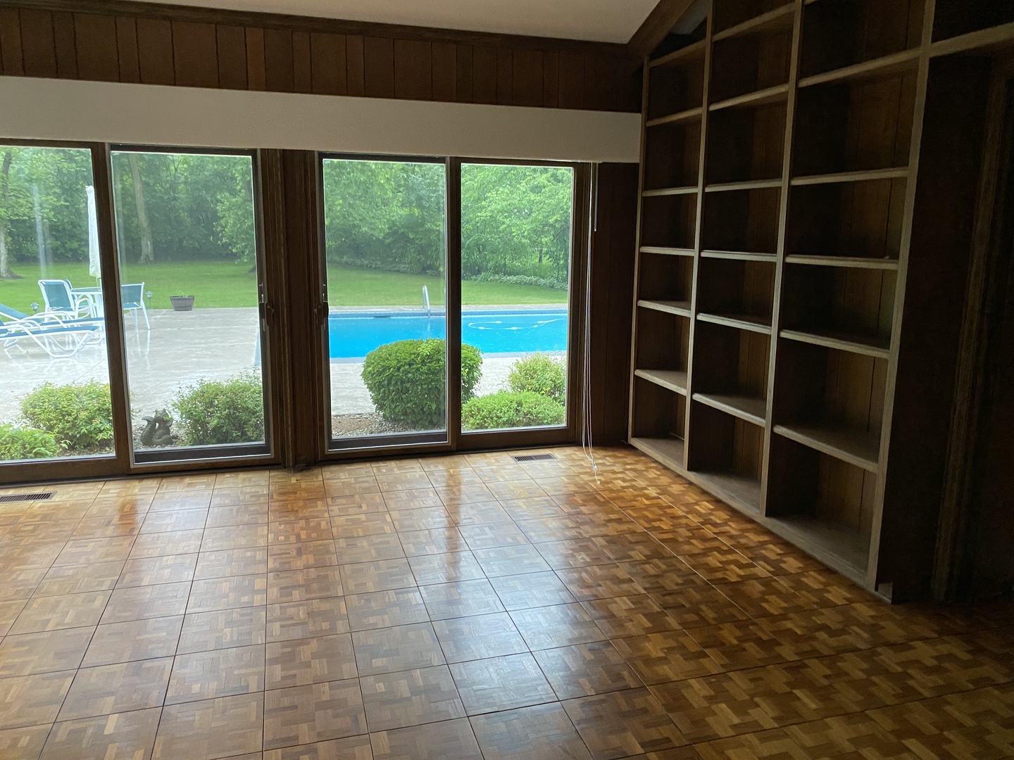 1780 Sunset Ridge Road Northbrook, IL 60062 - Photo 8 of 11 a view of empty room with wooden floor and windows