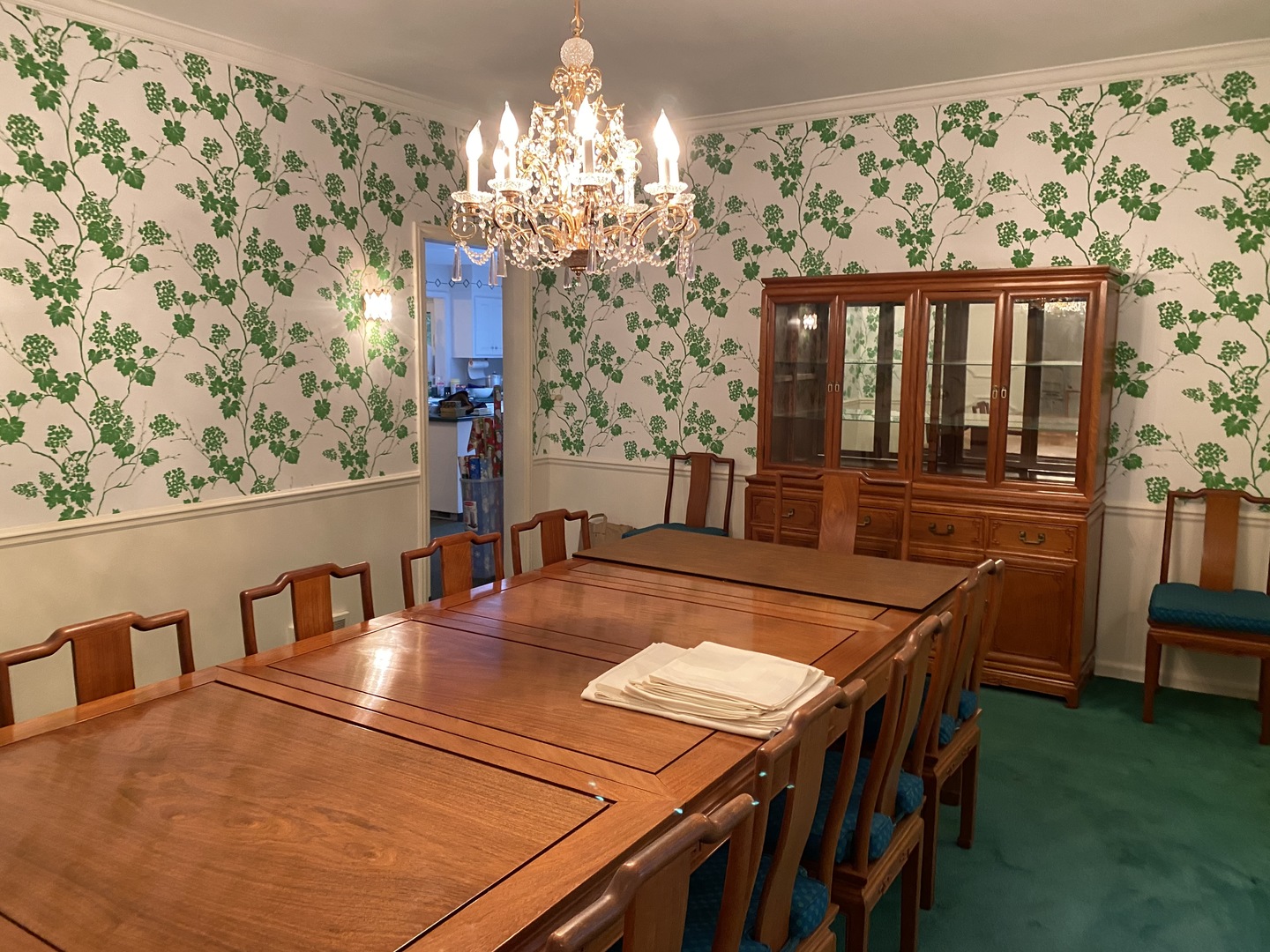 1780 Sunset Ridge Road Northbrook, IL 60062 - Photo 9 of 11 a dining room with furniture a chandelier and wooden floor
