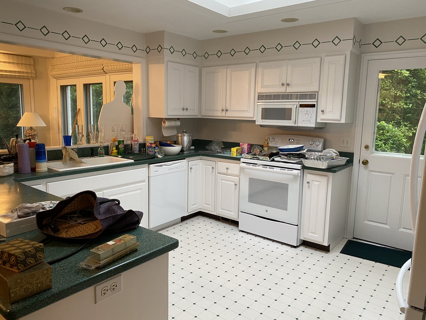1780 Sunset Ridge Road Northbrook, IL 60062 - Photo 10 of 11 a white kitchen with a stove a sink and dishwasher