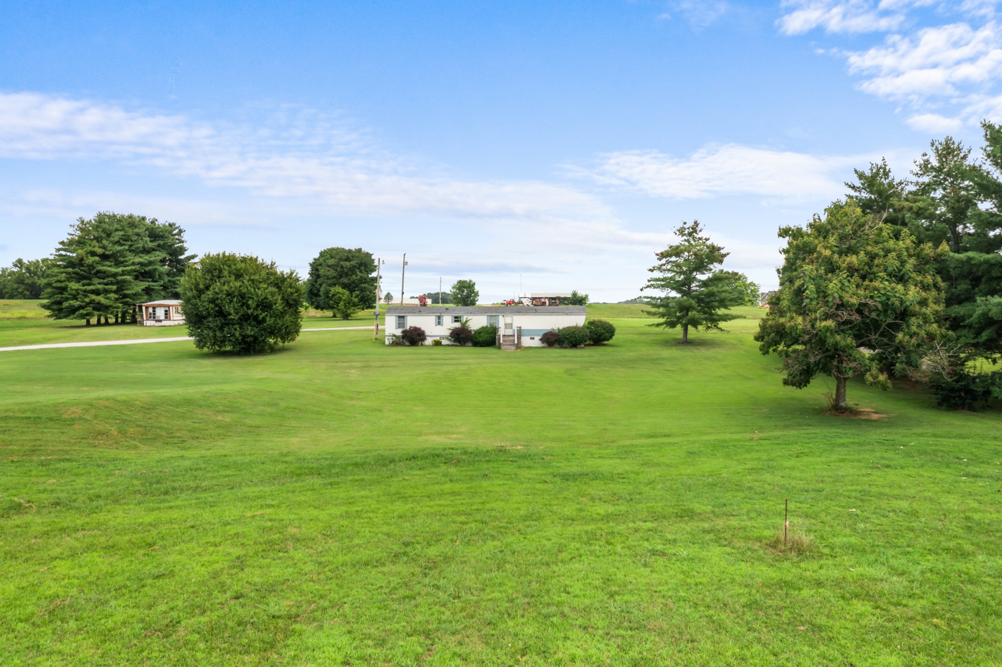 4534 Roy Cole Road Springfield, TN 37172 - Photo 1 of 16 a view of a green field with clear sky