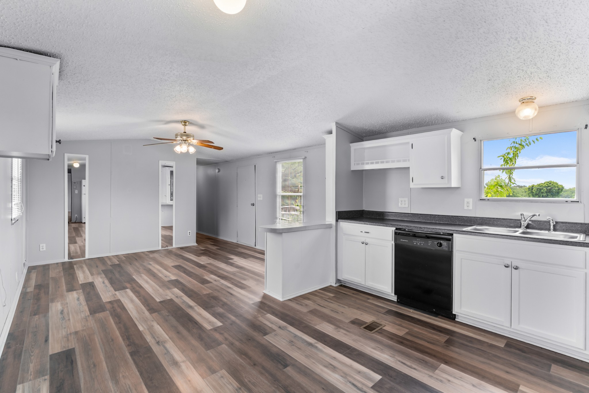 4534 Roy Cole Road Springfield, TN 37172 - Photo 9 of 16 a kitchen with granite countertop a stove a sink and a refrigerator