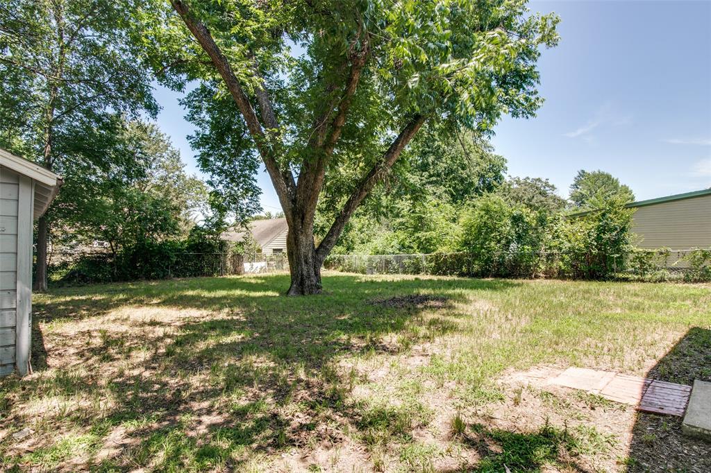 606 West High Street Terrell, TX 75160 - Photo 23 of 28 a view of a yard with a tree