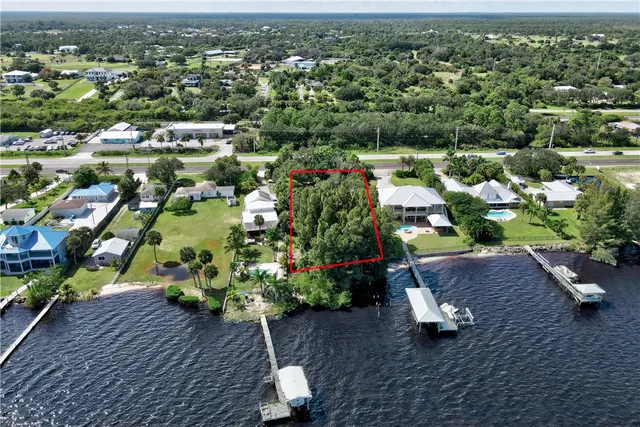 a street sign on a wall next to a road