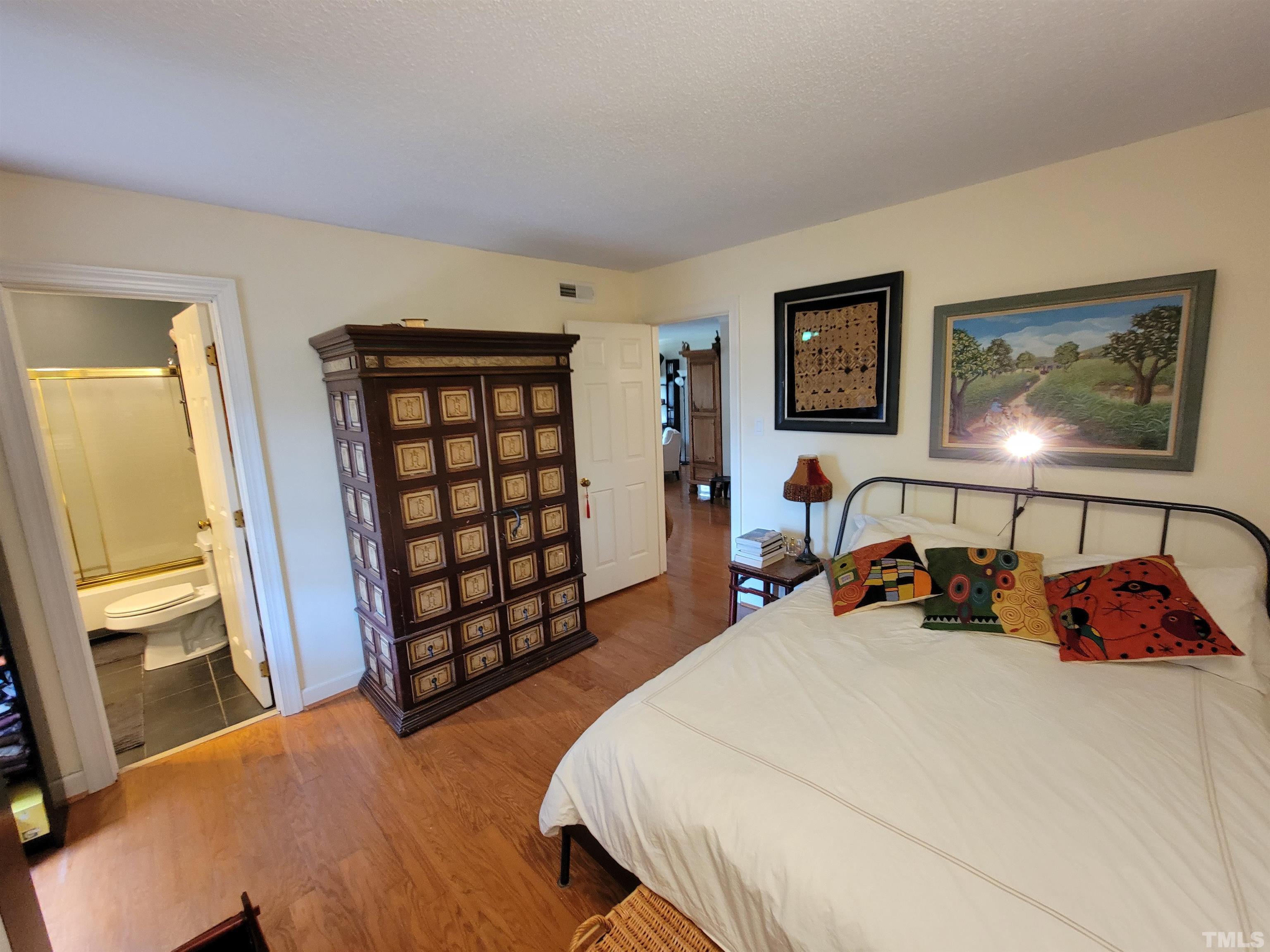 3601 Helix Court, Unit 302 Raleigh, NC 27606 - Photo 11 of 21 a bed room with a bed and a window