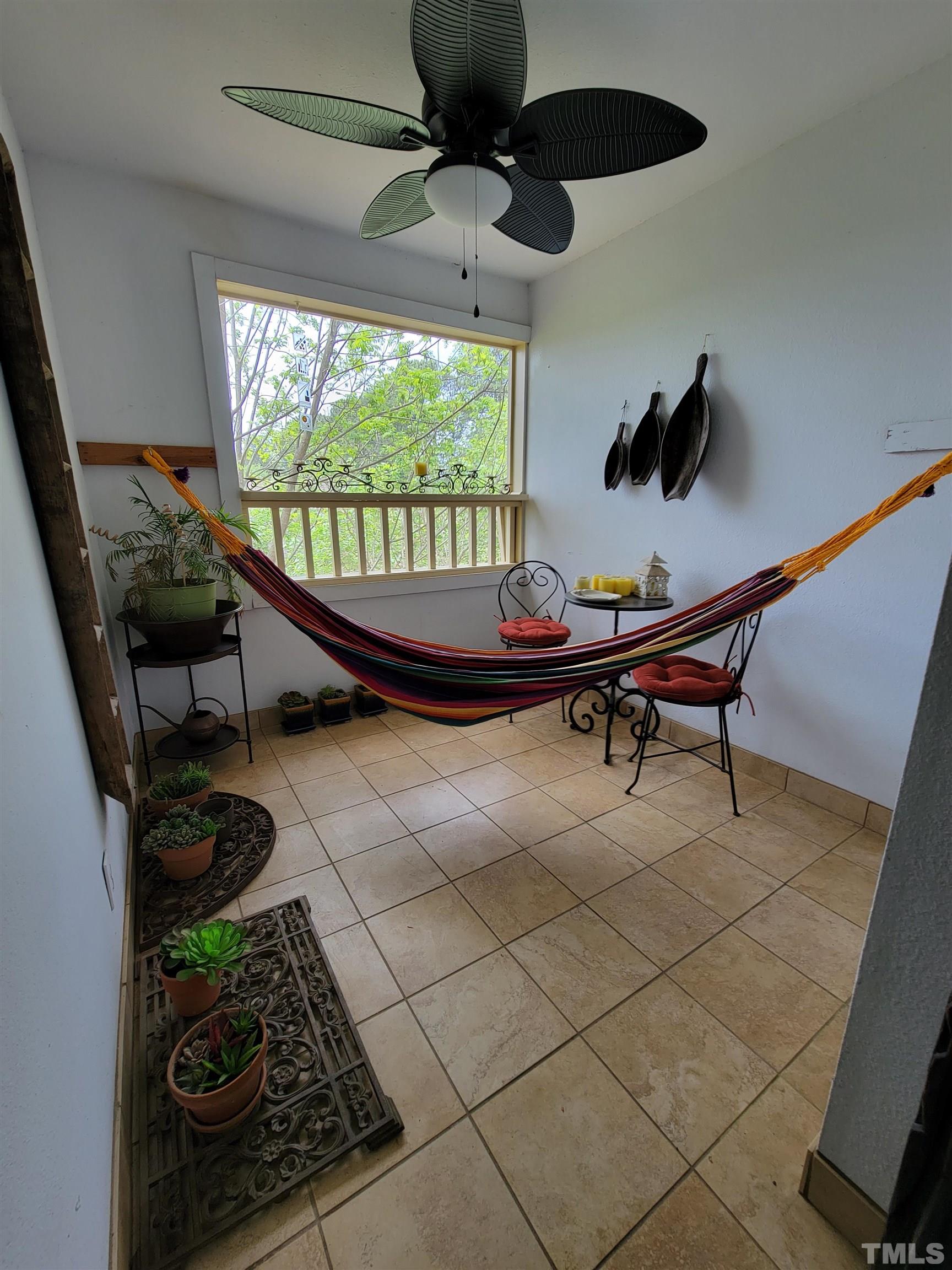 3601 Helix Court, Unit 302 Raleigh, NC 27606 - Photo 18 of 21 a room with a table and a flat screen tv