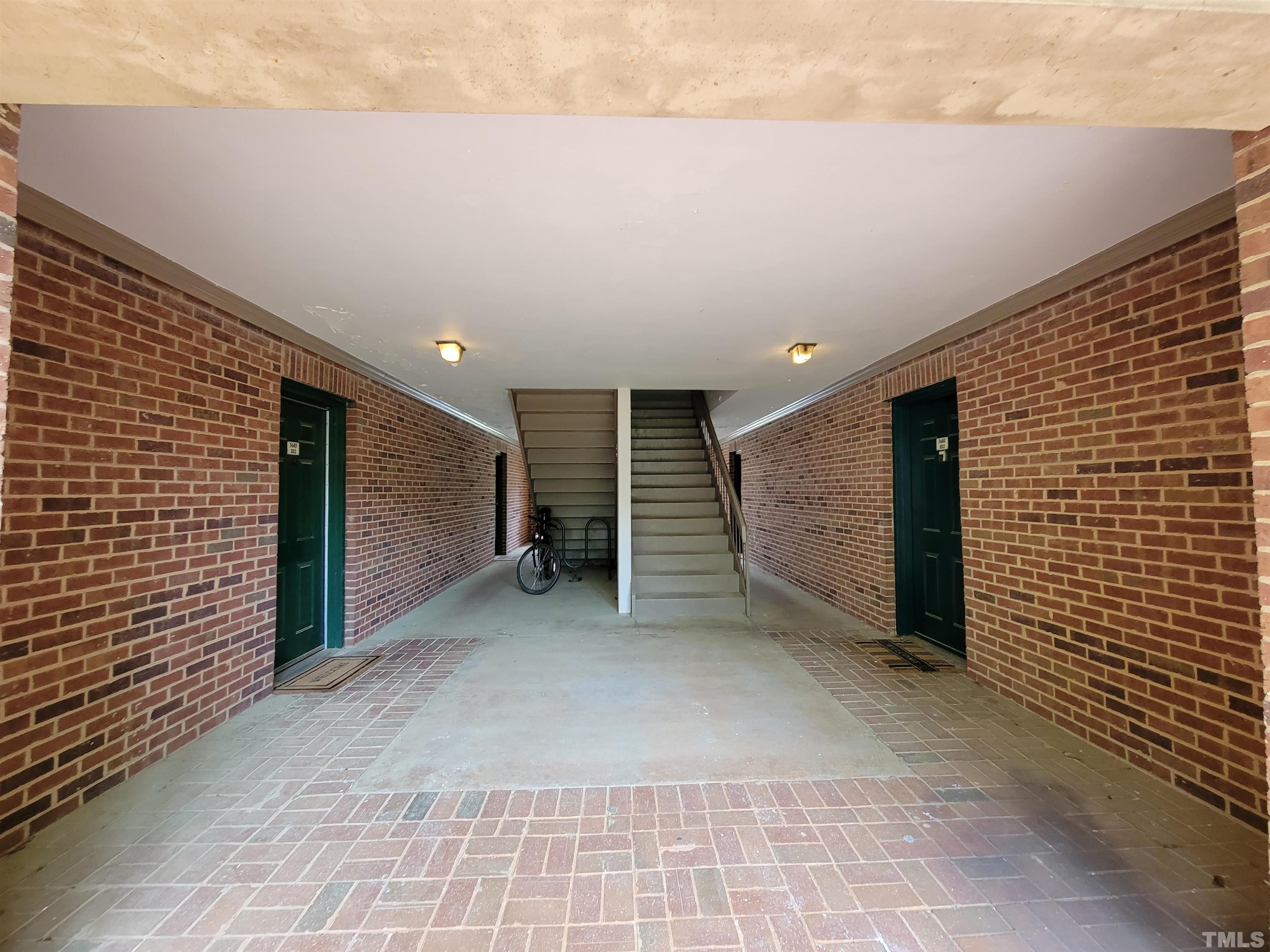 3601 Helix Court, Unit 302 Raleigh, NC 27606 - Photo 2 of 21 a view of a big room with wooden wall